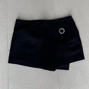 Black mini skort with silver grommet detail - perfect for a night out! 90s